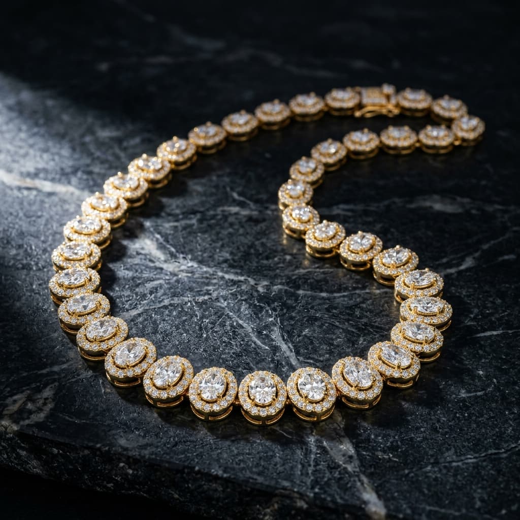 Diamond oval cluster necklace in 18kt gold laid on stone
